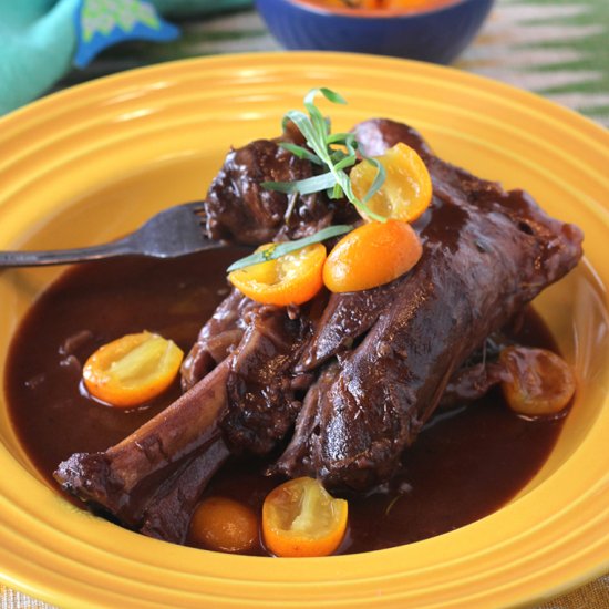 Braised lamb shanks with kumquats