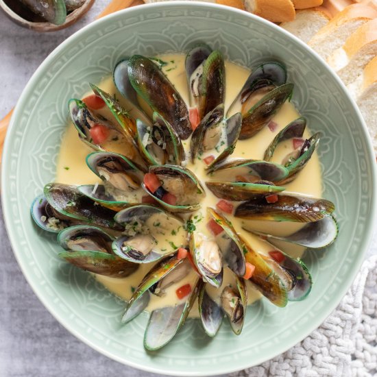 Mussels in white wine cream sauce.